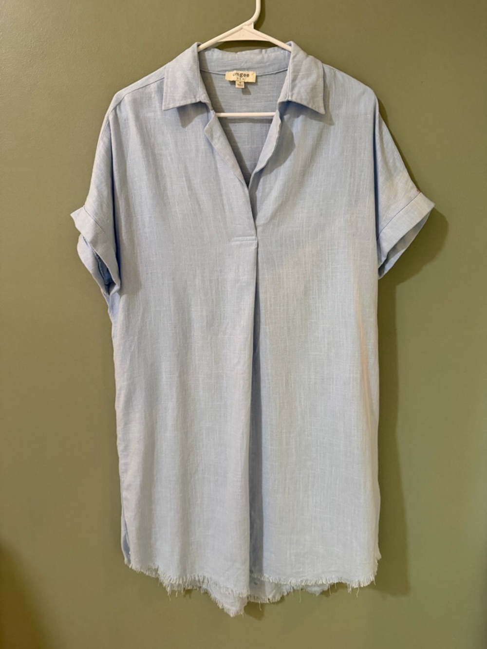 Umgee shirt dress features a relaxed fit, a collared neckline, size medium